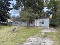 House with a grassy yard and trees at 2351 Elegans Dr, North Charleston, SC 29405