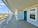 Building hallway with blue door and water views at 2395 Folly Road Rd # 4F, Folly Beach, SC 29439