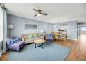 Living room with hardwood floors, comfy seating, and water views at 2395 Folly Road Rd # 4F, Folly Beach, SC 29439