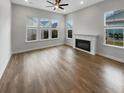 Bright living room featuring hardwood floors and fireplace at 376 Watergrass Way, Summerville, SC 29485