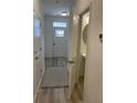 Bright entryway with luxury vinyl plank flooring and powder room at 493 Trotters Ln # 116, Moncks Corner, SC 29461