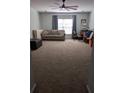 Large bonus room with carpeted floors, a sofa, and a workspace at 7315 Coopers Hawk Dr, Hanahan, SC 29410
