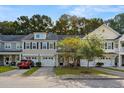 Townhome community with multiple units and lush green landscaping at 9632 Scarborough Ct, Summerville, SC 29485