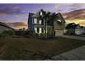 Two-story house with palm trees at sunset at 1209 Hammrick Ln, Johns Island, SC 29455