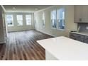 Spacious living room with hardwood floors and large windows at 764 Blueway Ave, Summerville, SC 29486