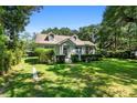 Quaint house with a spacious green lawn and beautiful landscaping at 2028 Coker Ave, Charleston, SC 29412