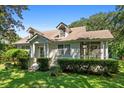 Adorable house with a well-maintained lawn and a screened porch at 2028 Coker Ave, Charleston, SC 29412