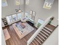 High-ceiling living room with hardwood floors, a sectional sofa, and a view from above at 268 Lucca Dr, Summerville, SC 29486