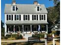 Farmhouse-style social center with a welcoming front porch at 3016 Cross Vine Ln, Summerville, SC 29483