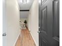 Bright entry hall with hardwood floors leading to the dining area at 444 Longleaf Dr, Summerville, SC 29483