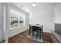 Dining area with table and chairs, hardwood floors and large window at 467 Eagleview Drive, Moncks Corner, SC 29461