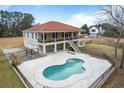 House with pool and a large backyard, viewed from above at 4712 Westervelt Rd, Meggett, SC 29449