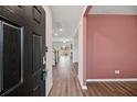 Bright and spacious entryway with dark hardwood floors and a view into the living area at 8700 Forte Dr, North Charleston, SC 29406