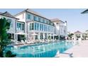 Luxury resort pool with lounge chairs and a large white building in background at 9005 Stern Aly, Johns Island, SC 29455