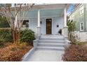 Inviting front porch with wooden steps and charming entryway at 11 Perry St, Charleston, SC 29403
