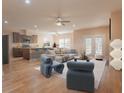 Open concept living room and kitchen with hardwood floors and a neutral color scheme at 1374 Leisure Dr, Summerville, SC 29486