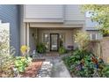 Inviting front entrance with lush landscaping and brick accents at 14 Wappoo Creek Pl, Charleston, SC 29412