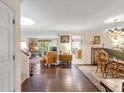 Open floor plan with hardwood floors, dining area, and living room at 14 Wappoo Creek Pl, Charleston, SC 29412