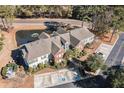 Brick building with pond and parking lot in a wooded area at 1728 Wyngate Cir, Mount Pleasant, SC 29466