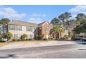 Two-story building with parking in front and trees behind at 1728 Wyngate Cir, Mount Pleasant, SC 29466