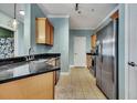 Kitchen with stainless steel appliances and wood cabinets at 1984 Folly Rd # B214, Charleston, SC 29412