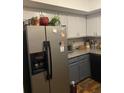 Stainless steel refrigerator and granite countertops in the kitchen at 208 Horseshoe Dr, Goose Creek, SC 29445