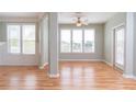 Bright dining area with hardwood floors and large windows at 2333 Chatelain Way, Mount Pleasant, SC 29464
