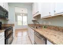 Kitchen with granite countertops, white cabinets and stainless steel appliances at 2333 Chatelain Way, Mount Pleasant, SC 29464