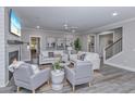 Open concept living room with fireplace and plenty of natural light at 270 Darby Meadow Ln, Ridgeville, SC 29472