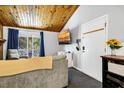 Living room features a large TV, balcony access, and relaxing seating at 279 Driftwood Ln, Edisto Beach, SC 29438
