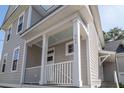 Front porch with white columns and railing at 454 Woodland Shores Rd, Charleston, SC 29412