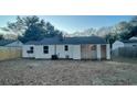 Large backyard with a wooden fence and shed at 5614 Read St, North Charleston, SC 29406