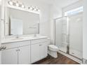 Main bathroom with double vanity, large mirror, and a glass shower at 809 Recess Pointe Dr # 51, Moncks Corner, SC 29461