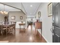 Hardwood floors, dining room, and view into the living room at 9736 Black Willow Ln, Ladson, SC 29456