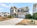 Two-story house with gray siding, white trim, and a two-car garage at 9736 Black Willow Ln, Ladson, SC 29456