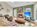 Living room with fireplace, hardwood floors, and large windows at 113 Ashton Dr, Goose Creek, SC 29445