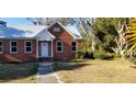 Charming brick home with metal roof, and a walkway at 12240 Green Pond Hwy, Green Pond, SC 29446