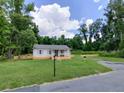 Charming one-story house with a large green lawn at 159 Hayes Ln, Williams, SC 29493