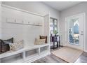 Bright entryway with built-in bench, hooks, and decorative accents at 240 Godwit Dr, Summerville, SC 29486
