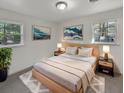Cozy bedroom with light wood platform bed and two windows at 3 Tommy Cir, Goose Creek, SC 29445