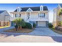 Two-story house with front porch, attached garage, and landscaped yard at 363 Clayton Dr, Charleston, SC 29414