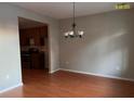 Bright dining room with hardwood floors and chandelier at 407 Hemingway Cir, Summerville, SC 29483