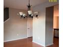 Dining room features hardwood floors and a chandelier at 407 Hemingway Cir, Summerville, SC 29483