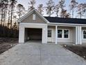 New construction craftsman style home with attached garage and front porch at 964 Dusk Dr, Summerville, SC 29486