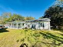 White house with a large backyard and covered porch at 1966 Suzanne St, Johns Island, SC 29455