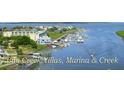 Aerial shot of Bay Creek Villas, marina, and creek at 3701 Dock Site Rd # 205, Edisto Beach, SC 29438