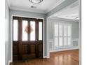 Bright entryway with hardwood floors and a view to the living room at 5382 Westchester Pl, North Charleston, SC 29418