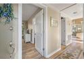 Bright hallway with light walls and wood flooring, leading to bedrooms and living areas at 604 Magnolia Walk, Edisto Island, SC 29438