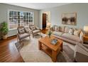 Spacious living room with hardwood floors and comfortable seating at 105 Gambels Ln, Summerville, SC 29485