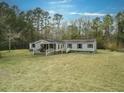 Ranch home with large yard and mature trees at 139 Yellowstone Ln, Ridgeville, SC 29472